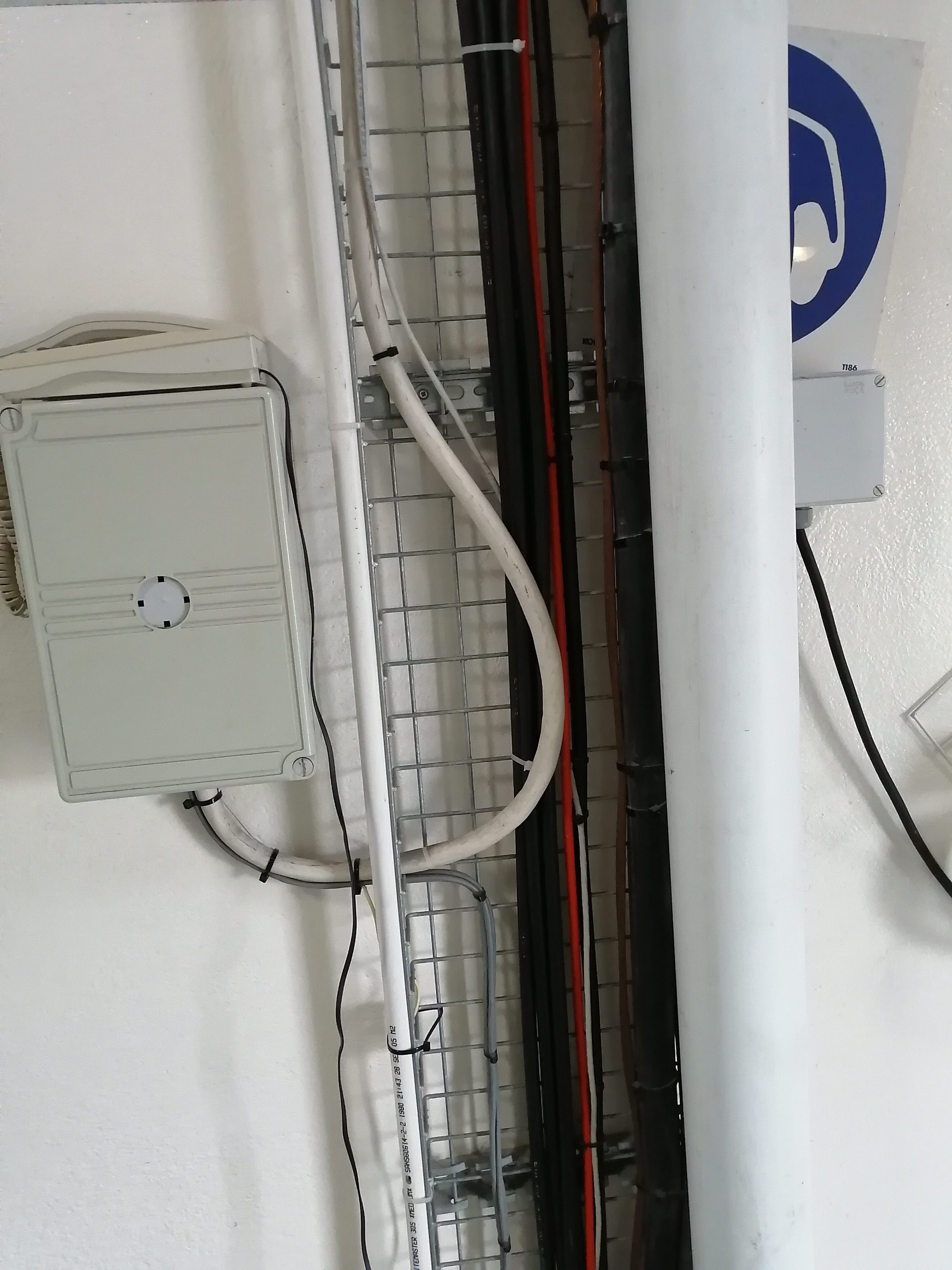 Wall-mounted fibre conduits and junction box